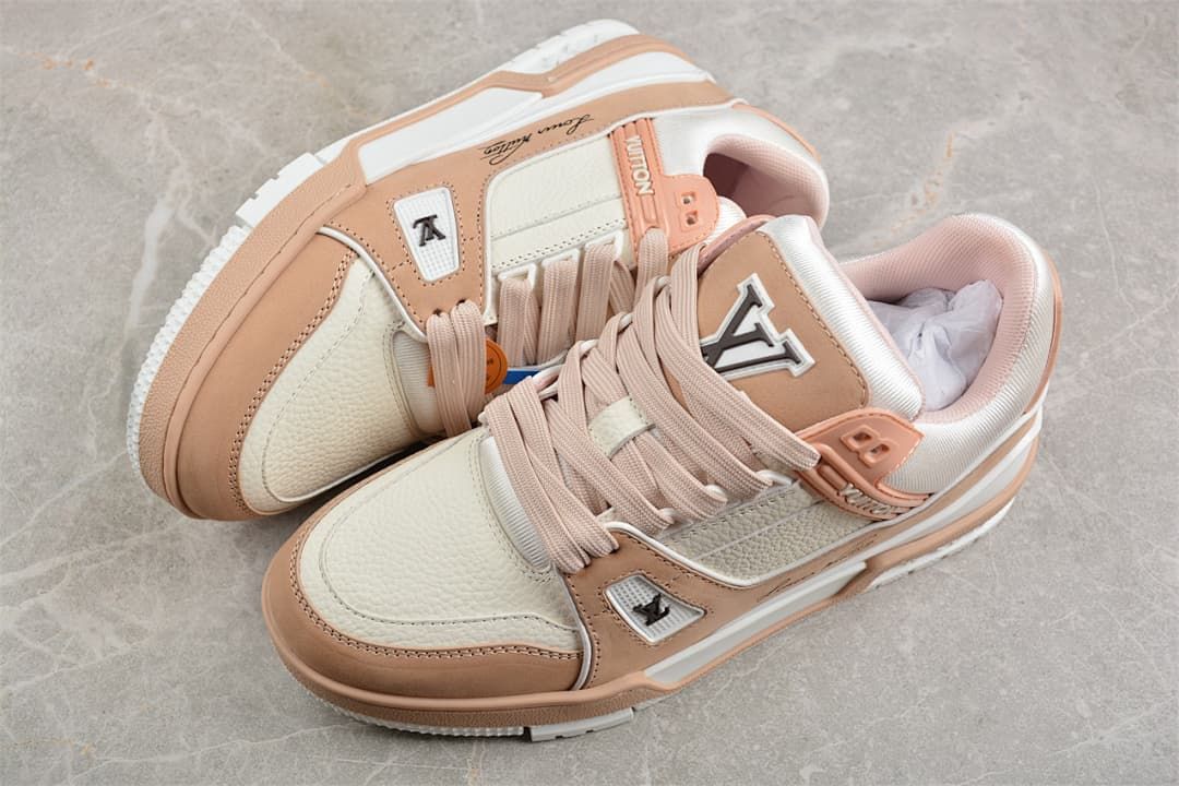 Pair of ivory-white and soft pink low-top sneakers viewed from above