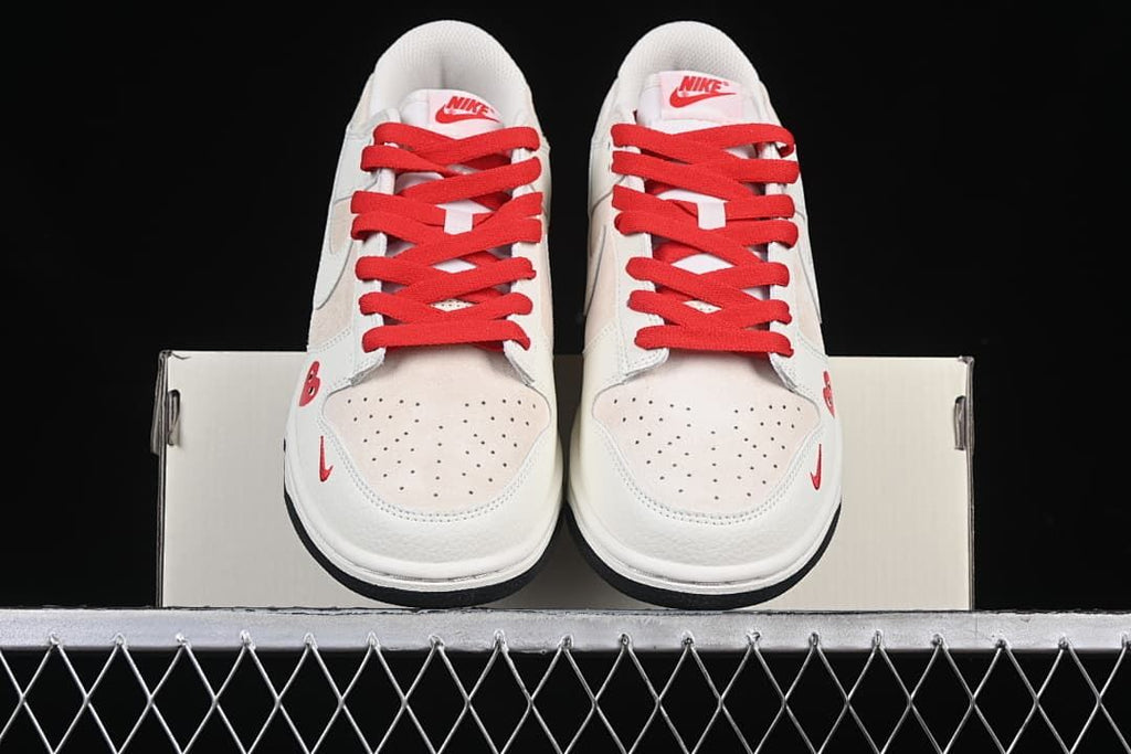 Front view of the pair showing perforated toes and red laces