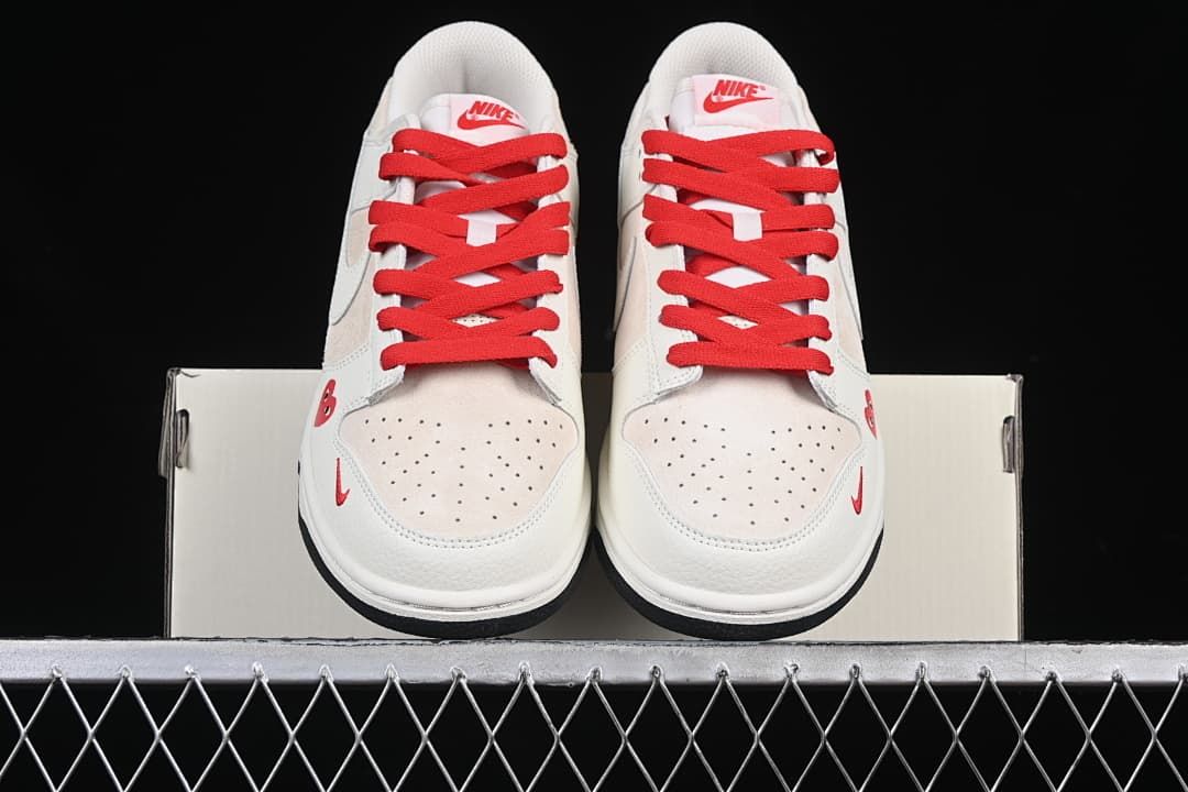 Front view of the pair showing perforated toes and red laces