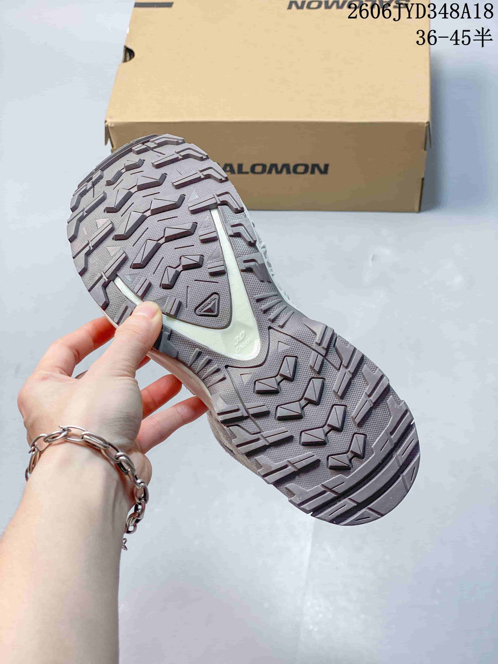 Close-up of the lugged outsole on a Salomon XT-3D shoe