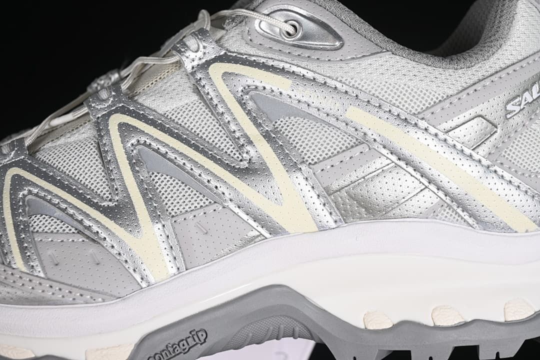 Close-up of the silver-gray side panels, overlay design, and outsole.