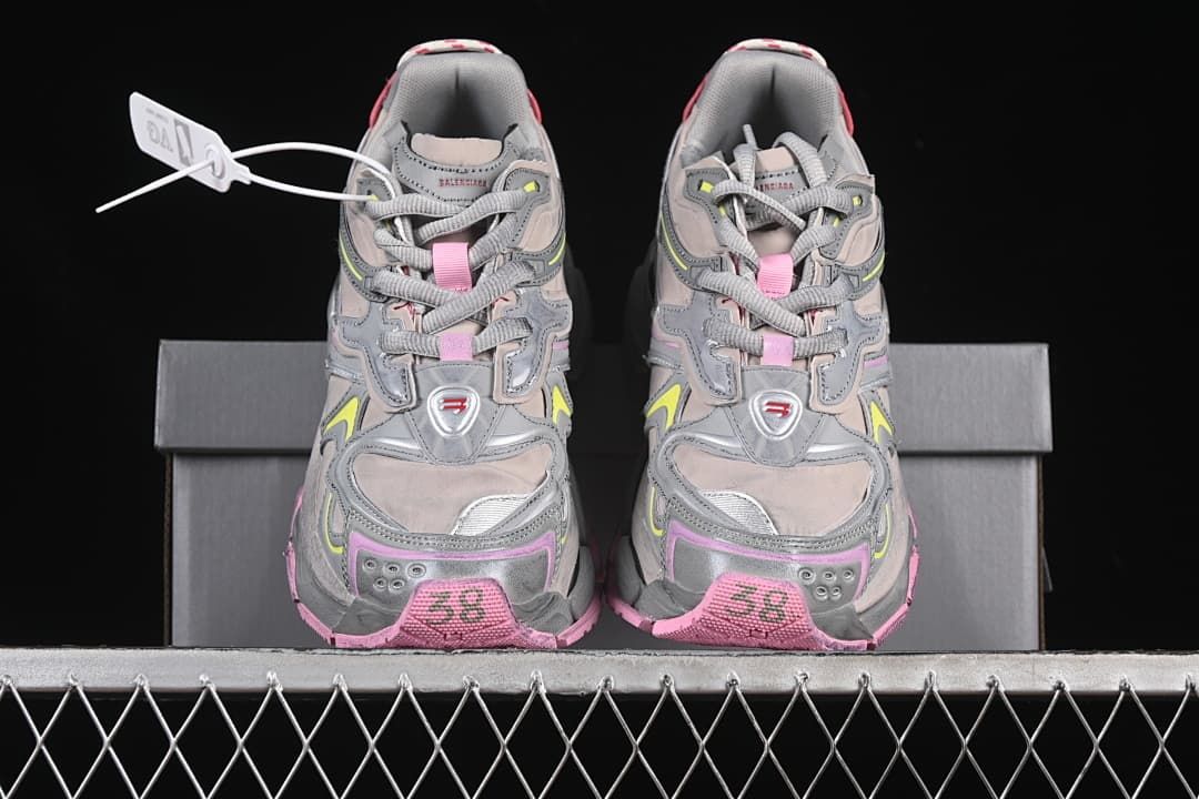 Front view of the pair showing layered uppers and pink toe accents.