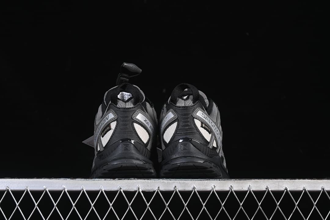 Rear view of the pair showing heel panels and outsole edges.