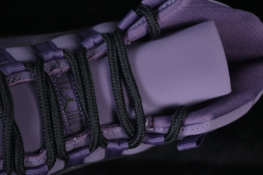 Top detail of the purple tongue and black laces.