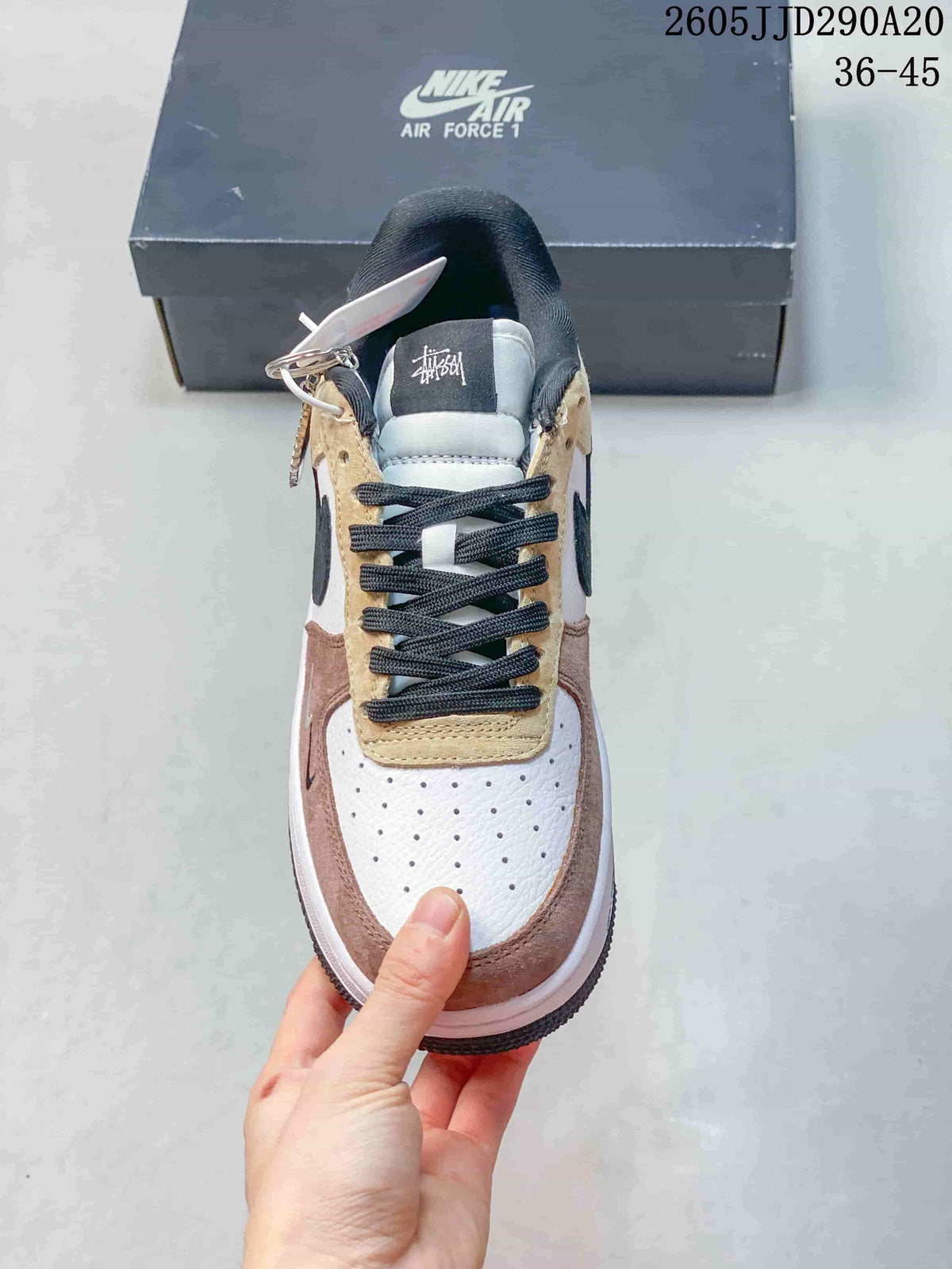 Top view showing black laces, a perforated toe, and layered panels