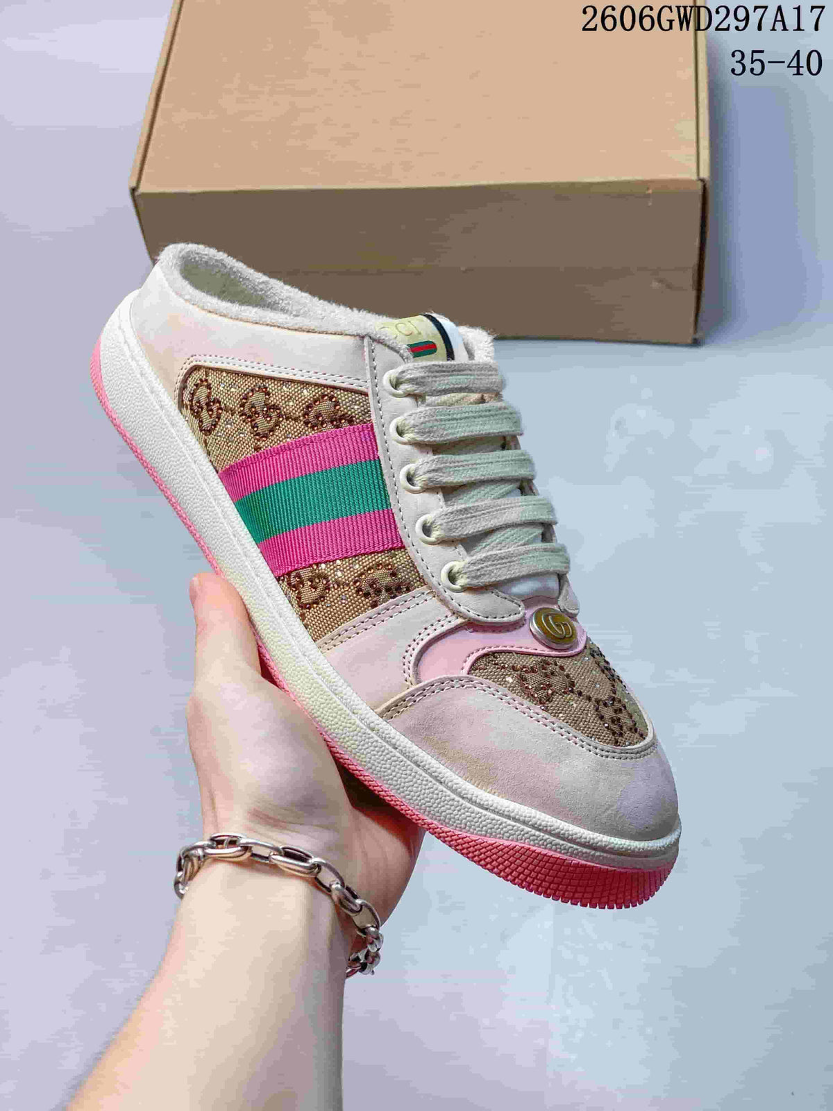 Side view of a beige and brown patterned lace-up sneaker with pink and green stripe details and a pink outsole.