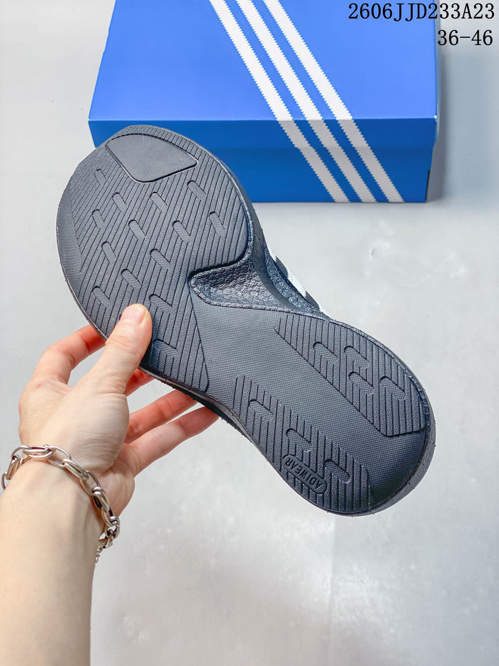 Close-up of the textured outsole on a charcoal gray sneaker