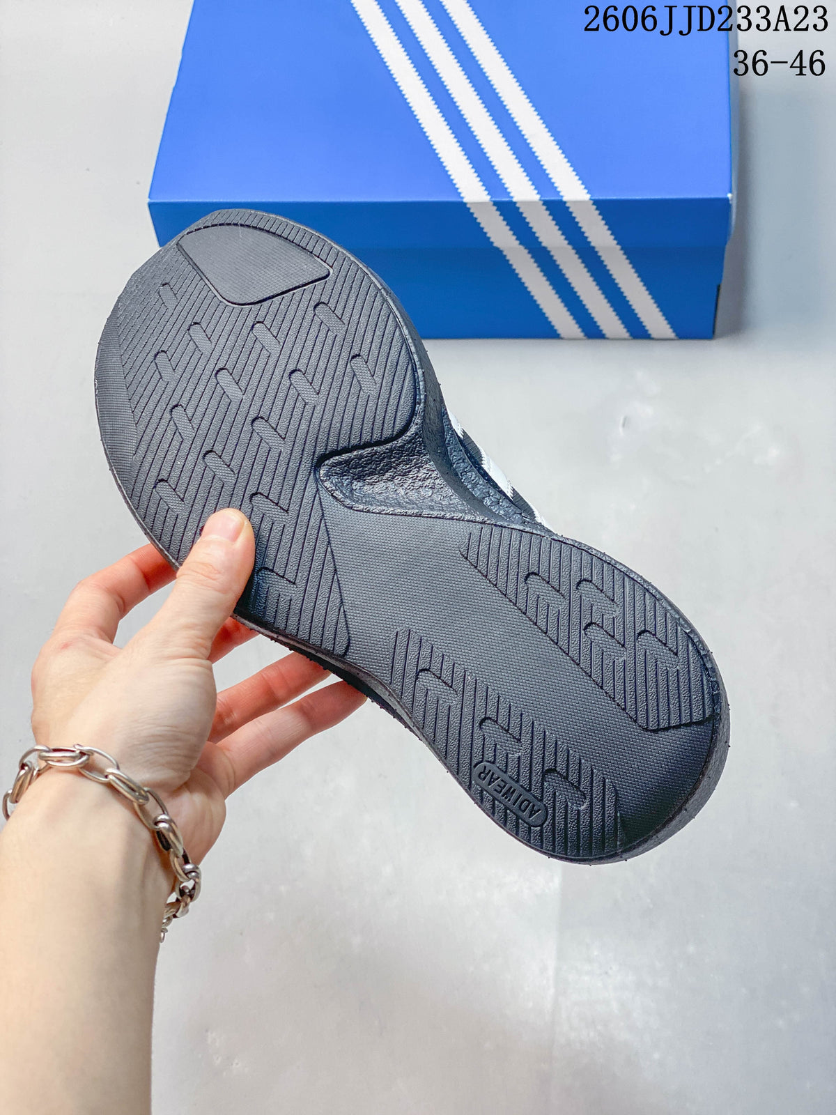 Close-up of the textured outsole on a charcoal gray sneaker
