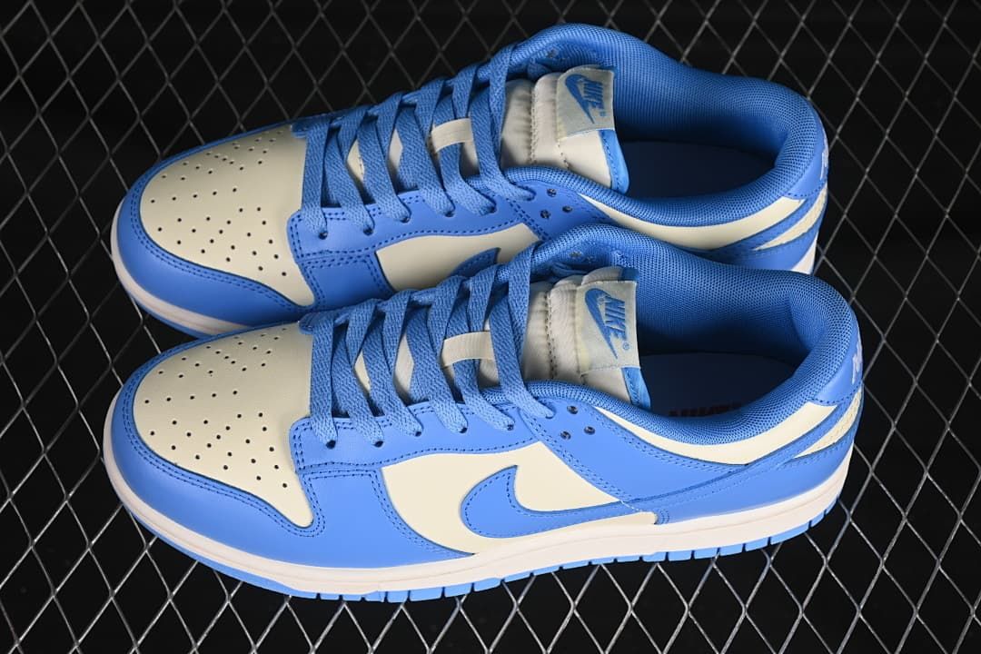 Pair of blue and cream Nike Dunk Low sneakers viewed from above