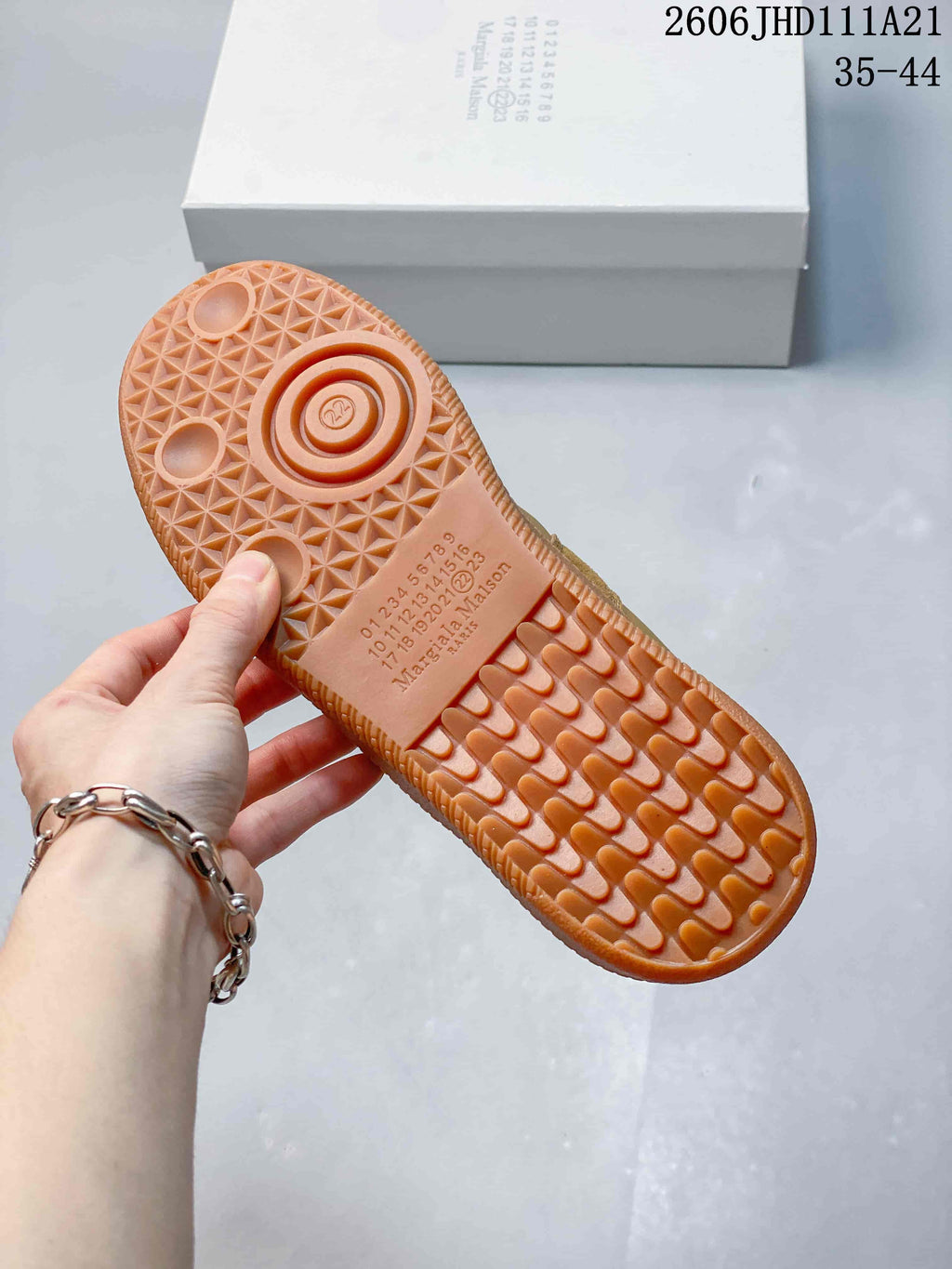 Close-up of the sneaker’s gum-colored outsole with patterned tread