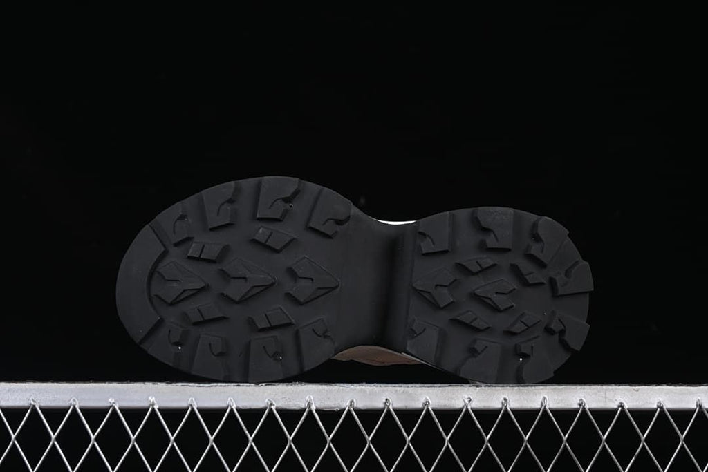 Underside view showing the black patterned outsoles