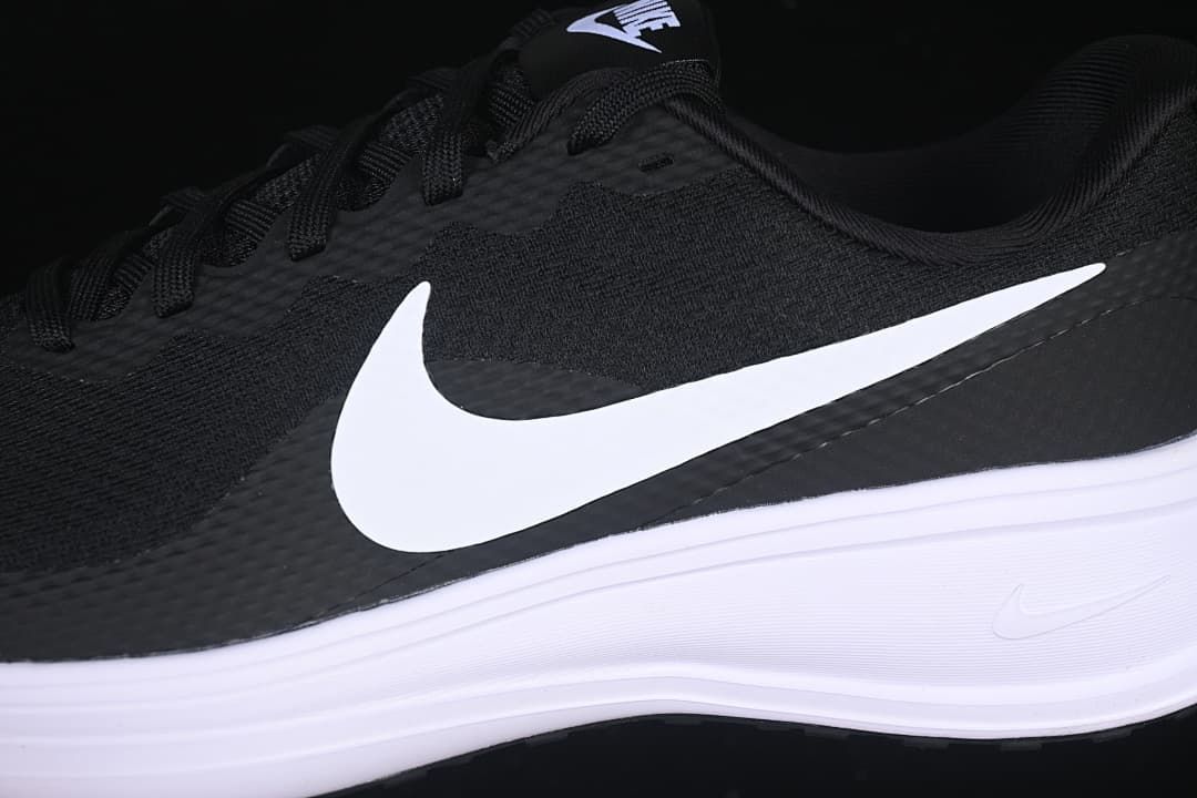 Close-up side view of the white Swoosh, black upper and white midsole