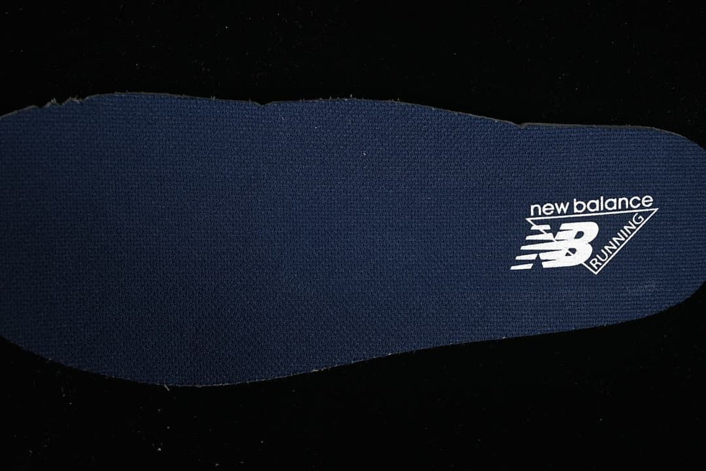 Navy insole with New Balance branding
