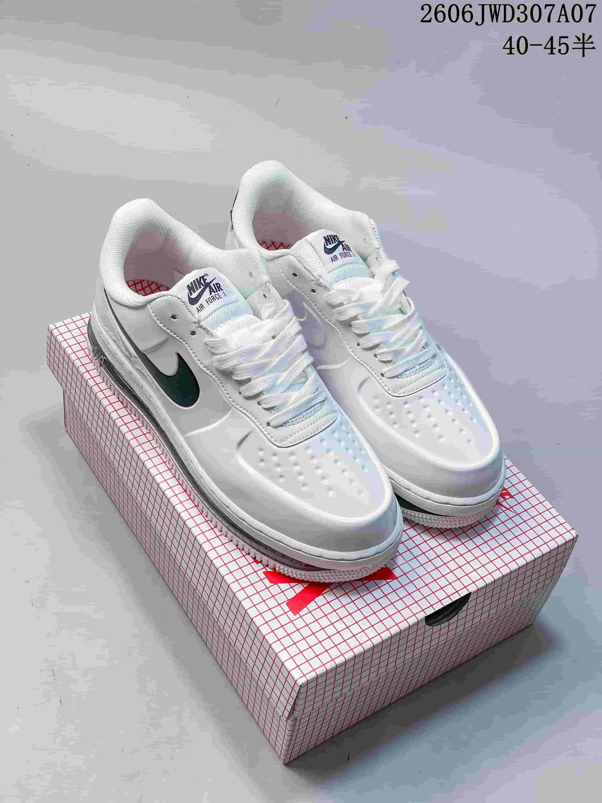 White Nike Air Force 1 low-top sneakers with dark Swooshes, shown on a shoebox.