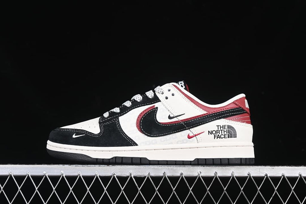 Side view of the shoe showing black Swoosh, red accents, and North Face graphics