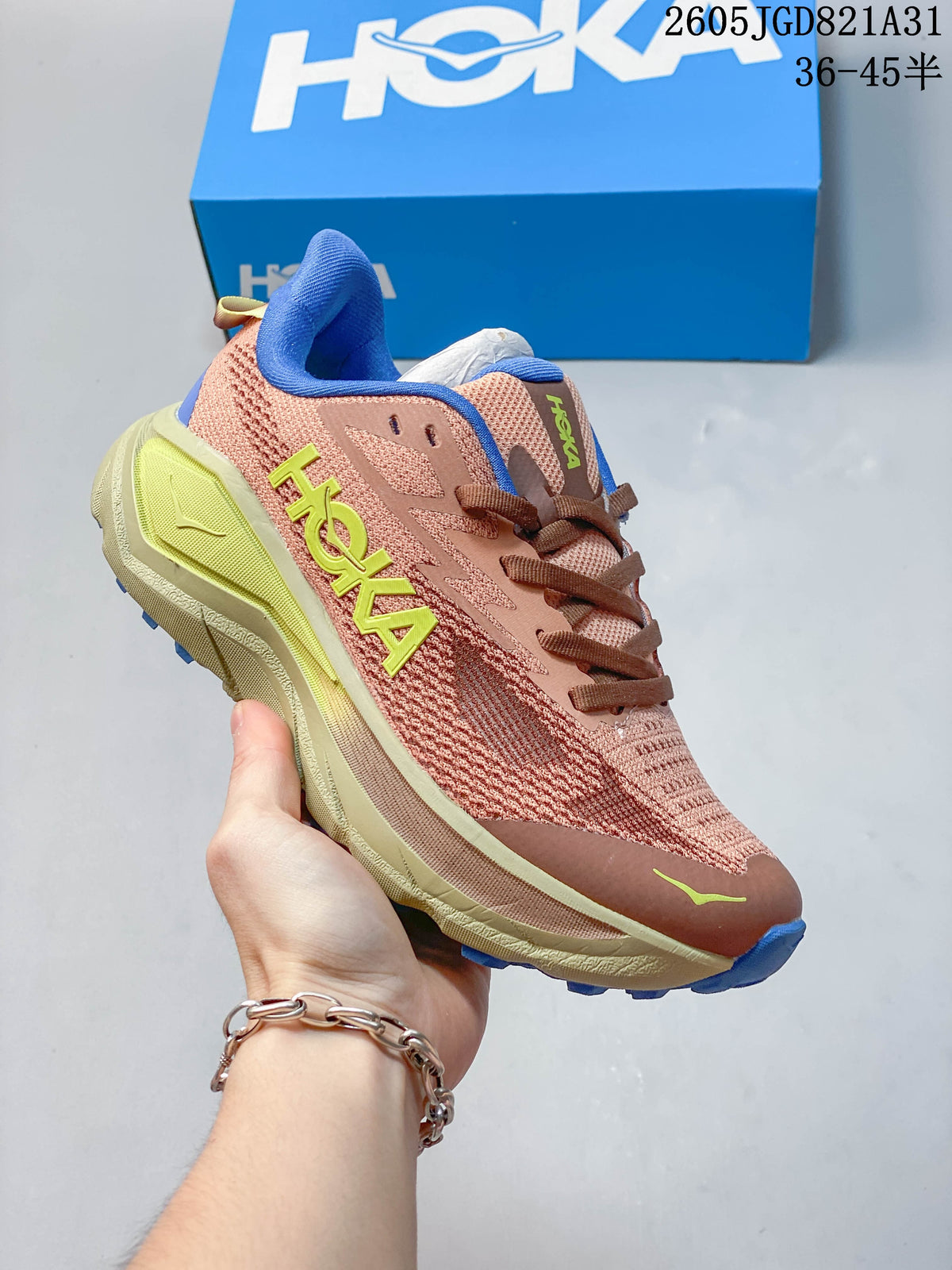 Pink HOKA Challenger 8 mesh running shoe with brown laces and yellow-green accents