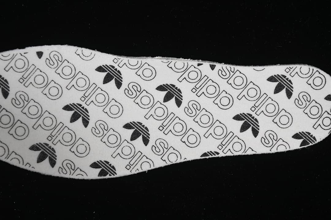Insole printed with repeating adidas text and trefoil logos
