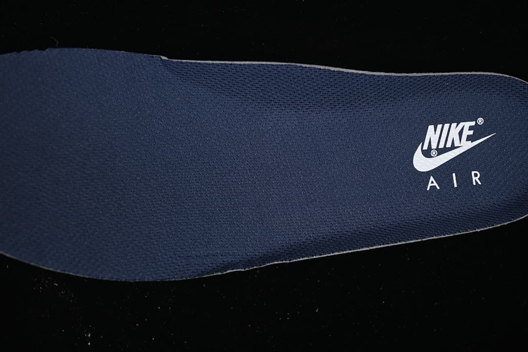 Close-up of a navy insole with Nike Air branding