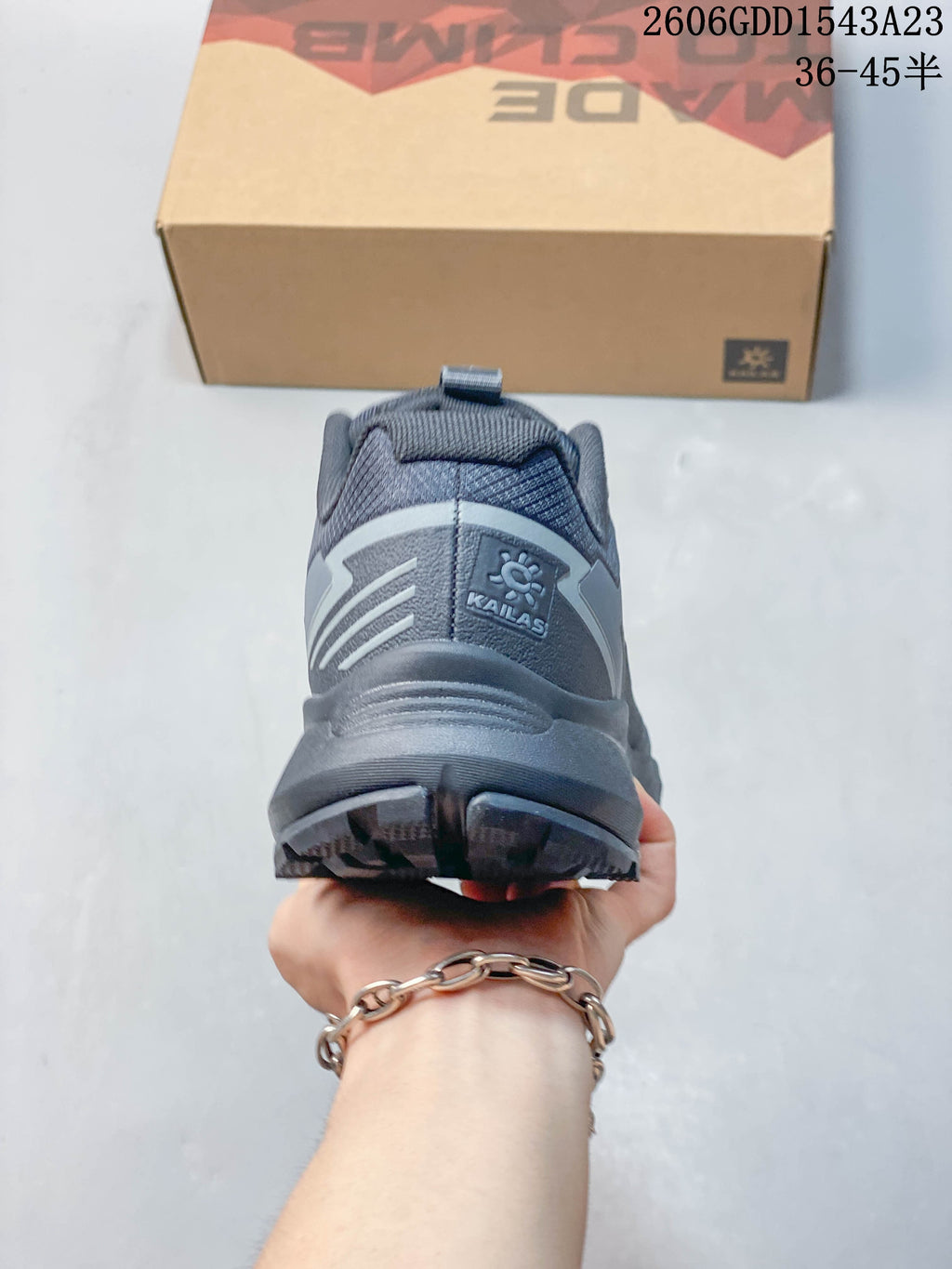 Rear view of a gray Kailas trail running shoe