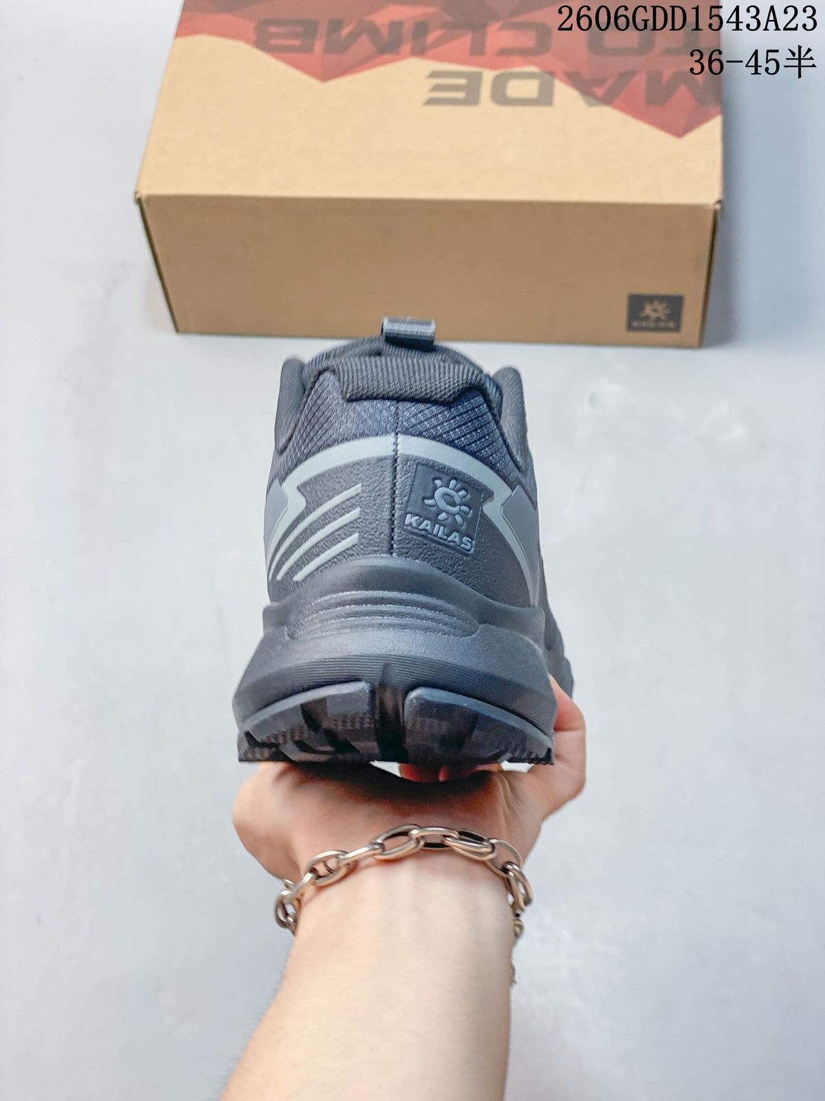 Rear view of a gray Kailas trail running shoe