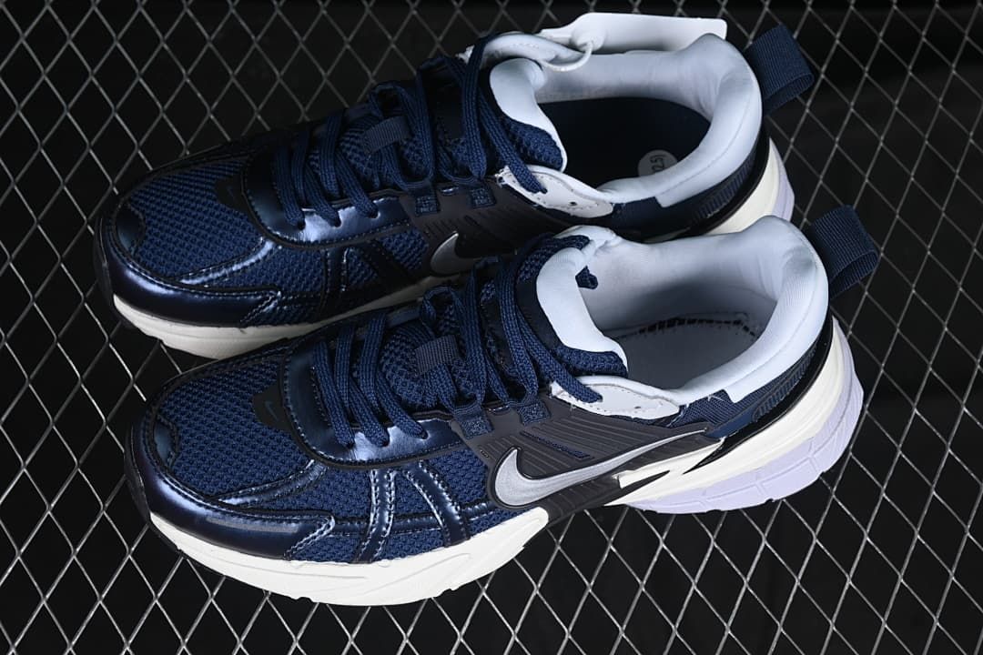 Pair of navy and white sneakers shown from above