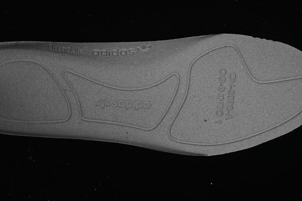 Close-up of the outsole with molded adidas branding