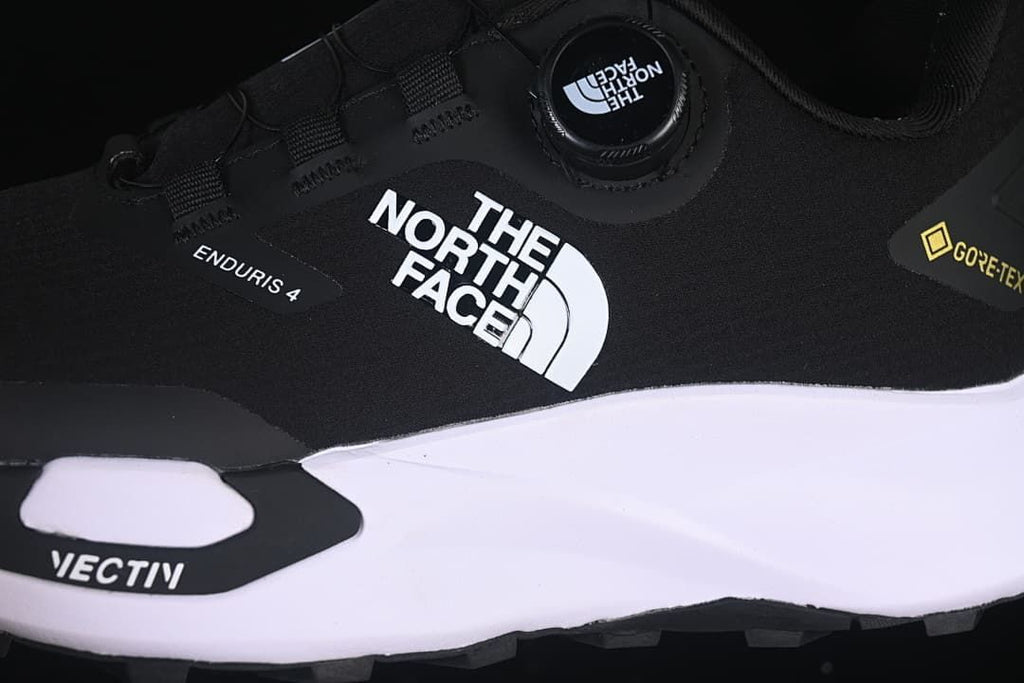 Side detail showing The North Face, Enduris 4, and Vectiv branding with dial lacing.