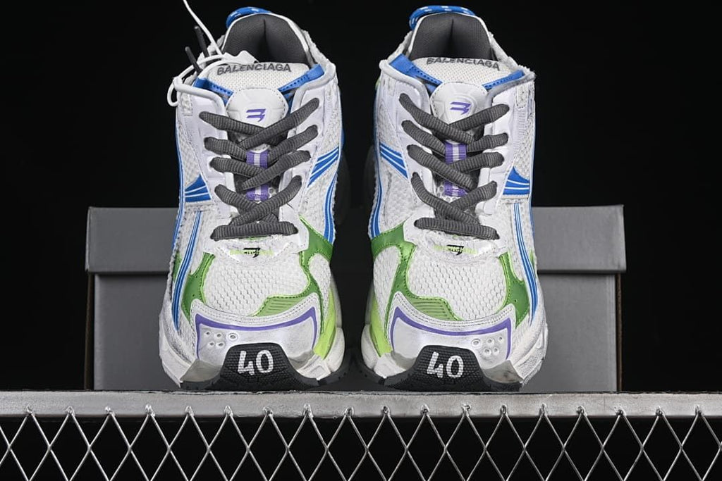 Front view of the pair showing dark laces and colorful toe details