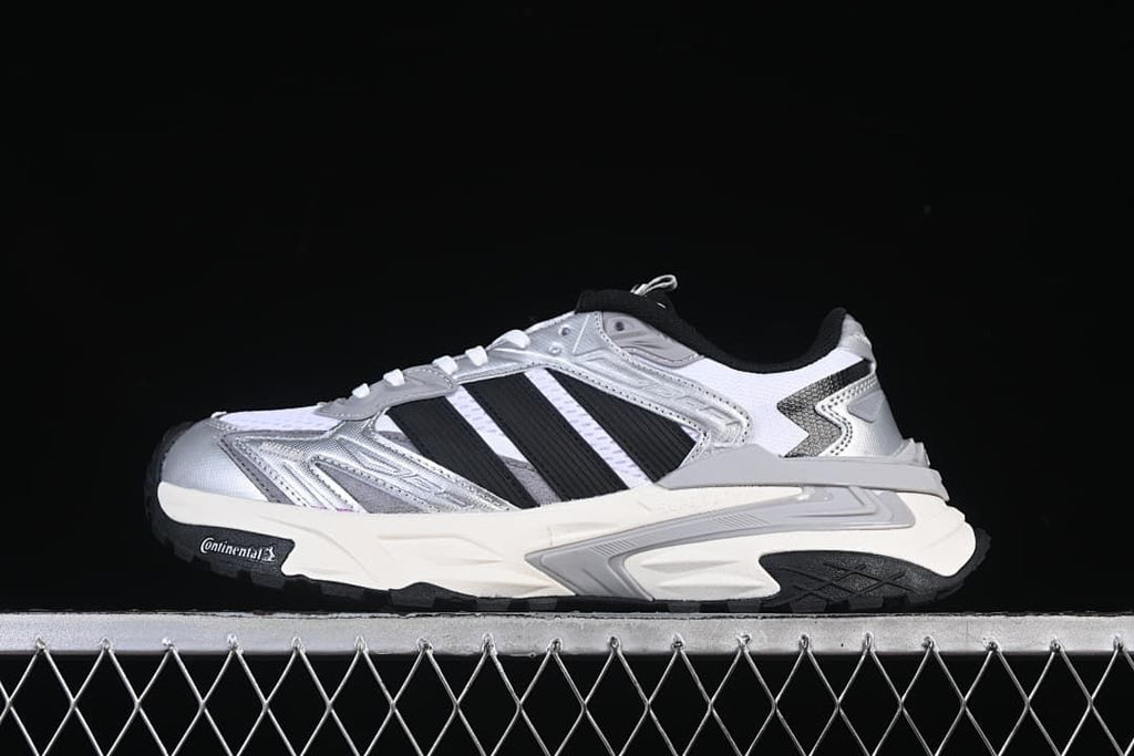 Side profile of silver, white and black Adidas XLG Storm Edge sneakers