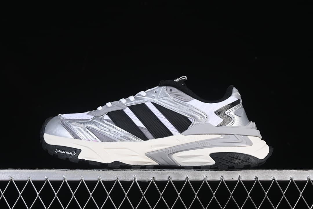 Side profile of silver, white and black Adidas XLG Storm Edge sneakers