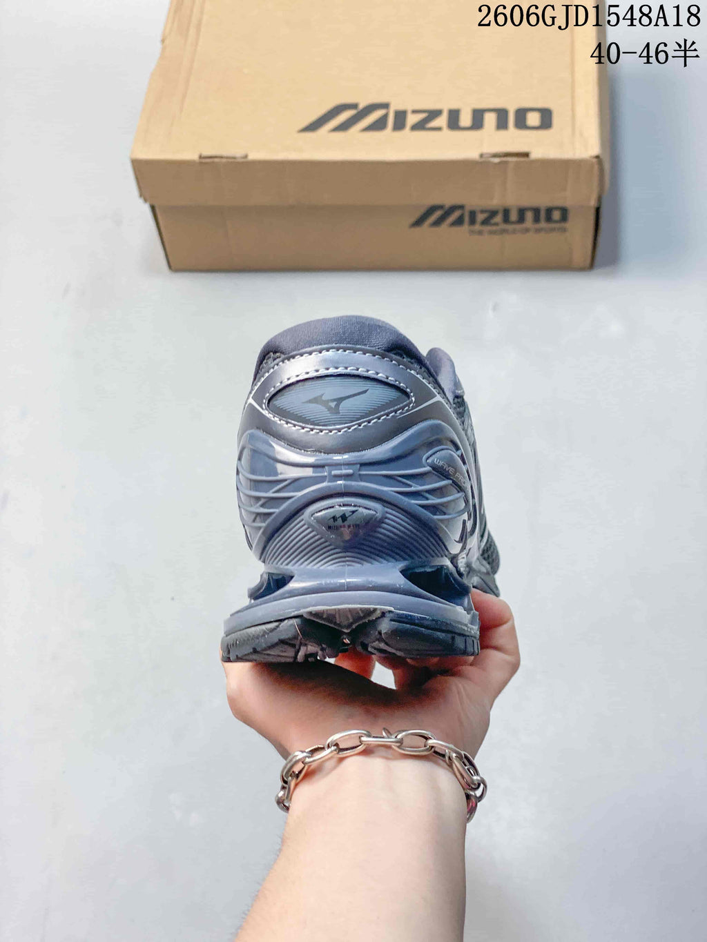Rear view showing the heel structure of a metallic gray Mizuno Prophecy 8 shoe