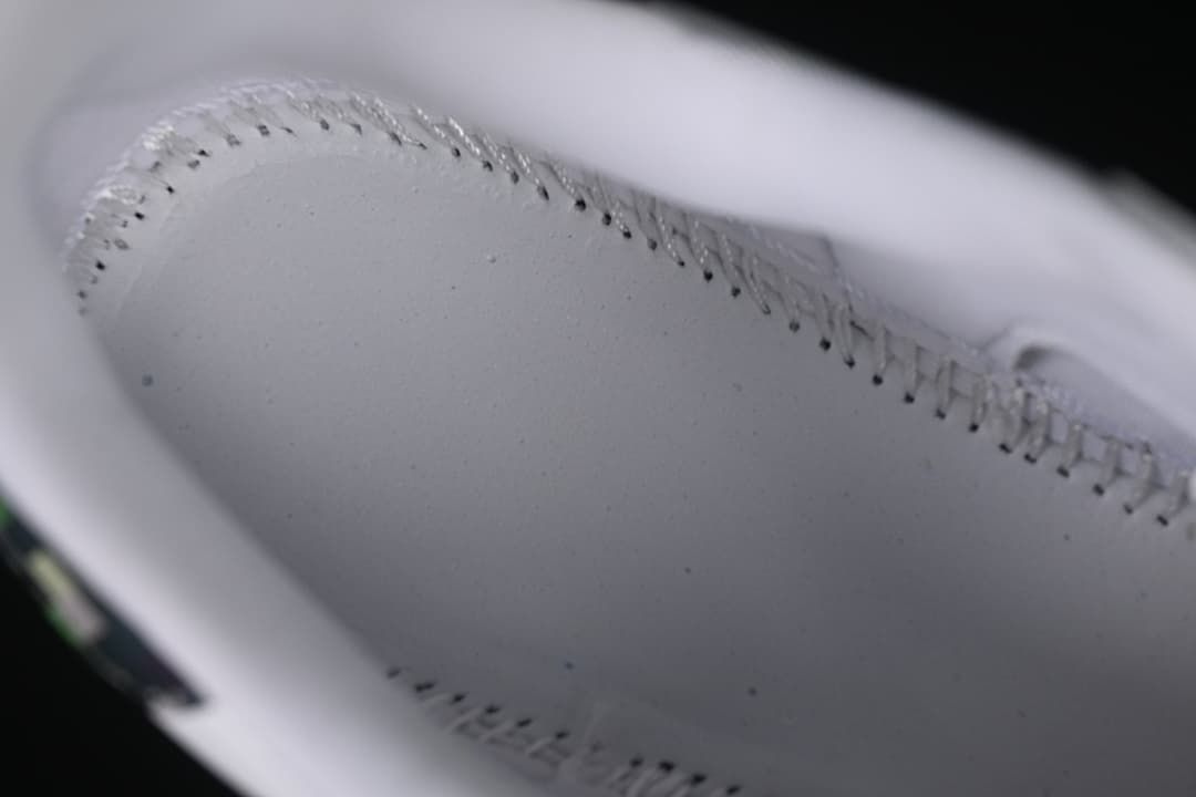 Close-up of stitching inside the white sneaker