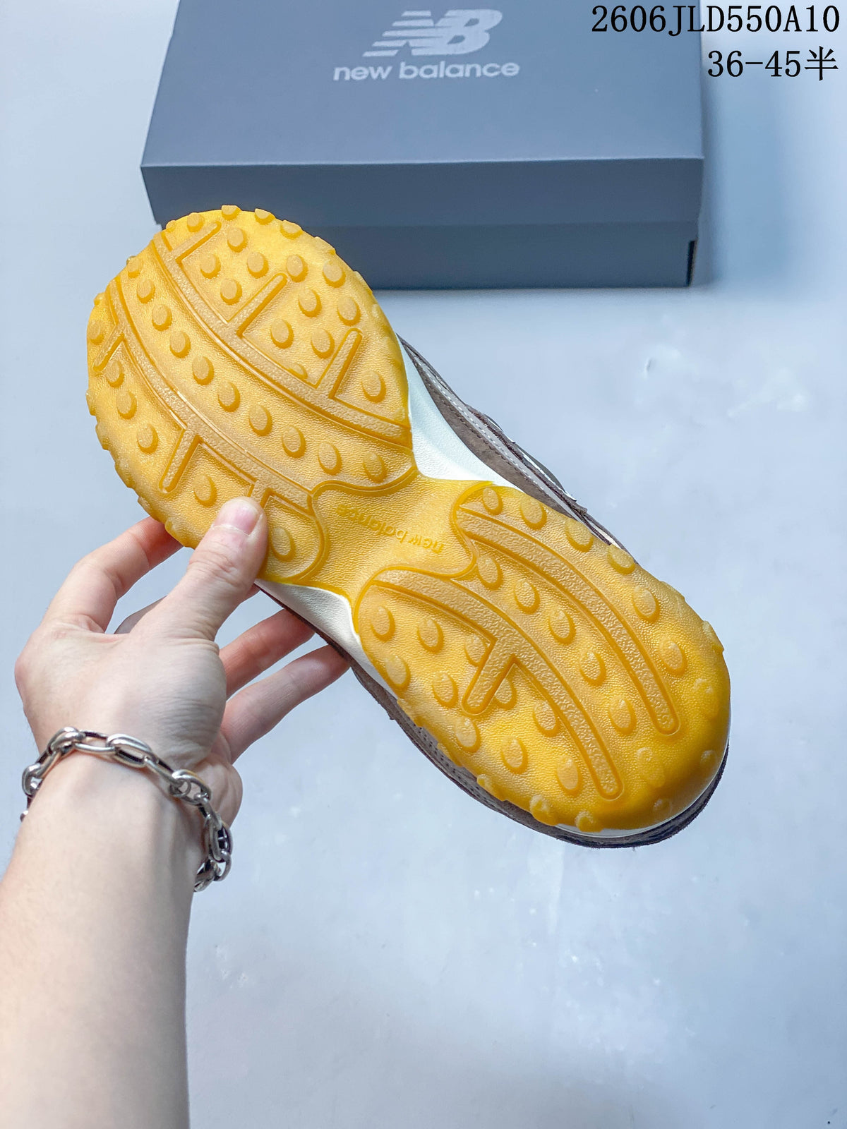 Close-up of the sneaker’s gum-colored outsole and tread