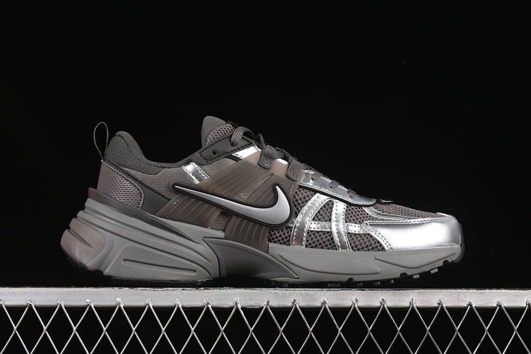 Side profile of a silver-gray Nike V2K Run sneaker