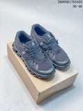 Pair of dark gray On Cloud 5 sneakers displayed on a box.
