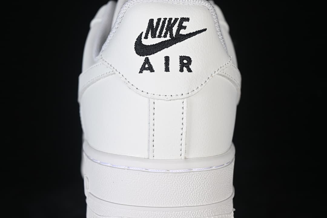 Rear close-up of the white sneaker with black Nike Air heel branding