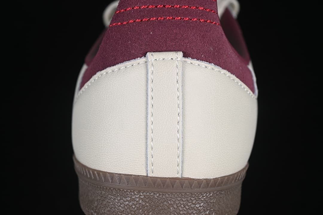 Rear close-up showing cream heel panels, burgundy heel tabs, and brown outsole.