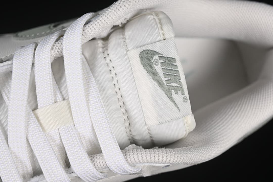 Close-up of the tongue label and white laces