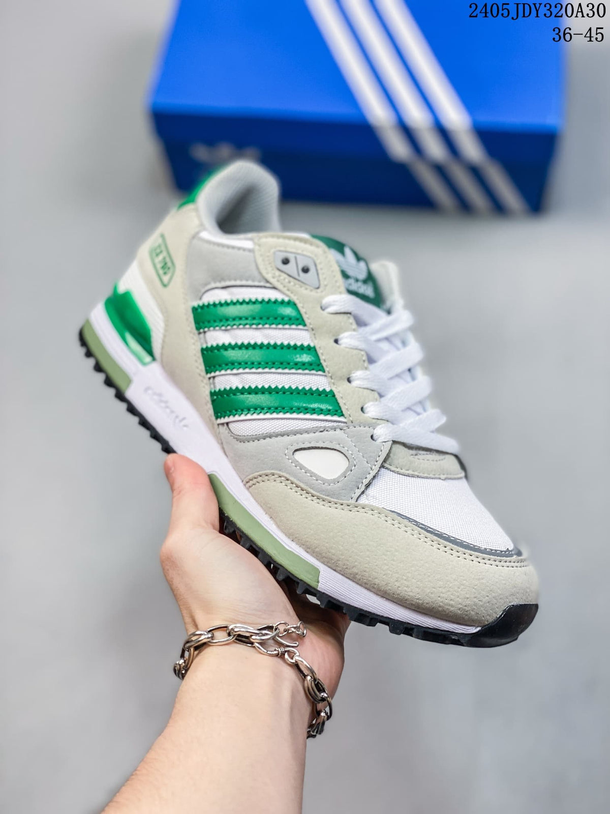 Angled side view of a white and green Adidas ZX 750 sneaker