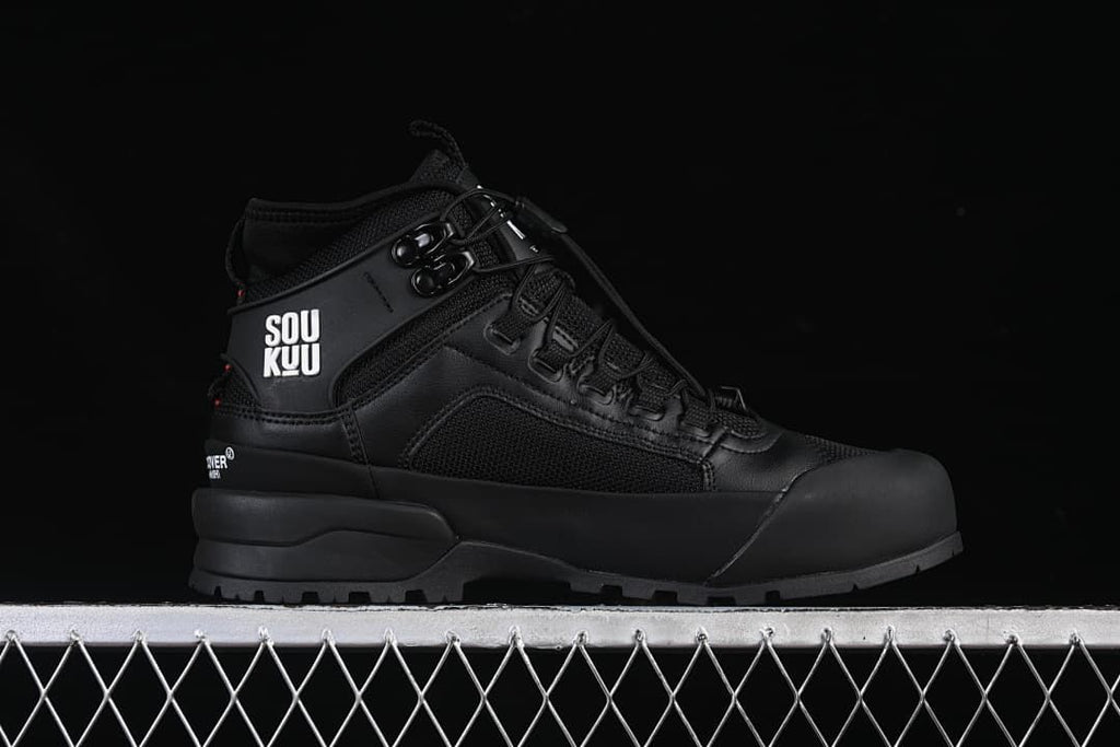 Side profile of the black mid-height hiking shoe