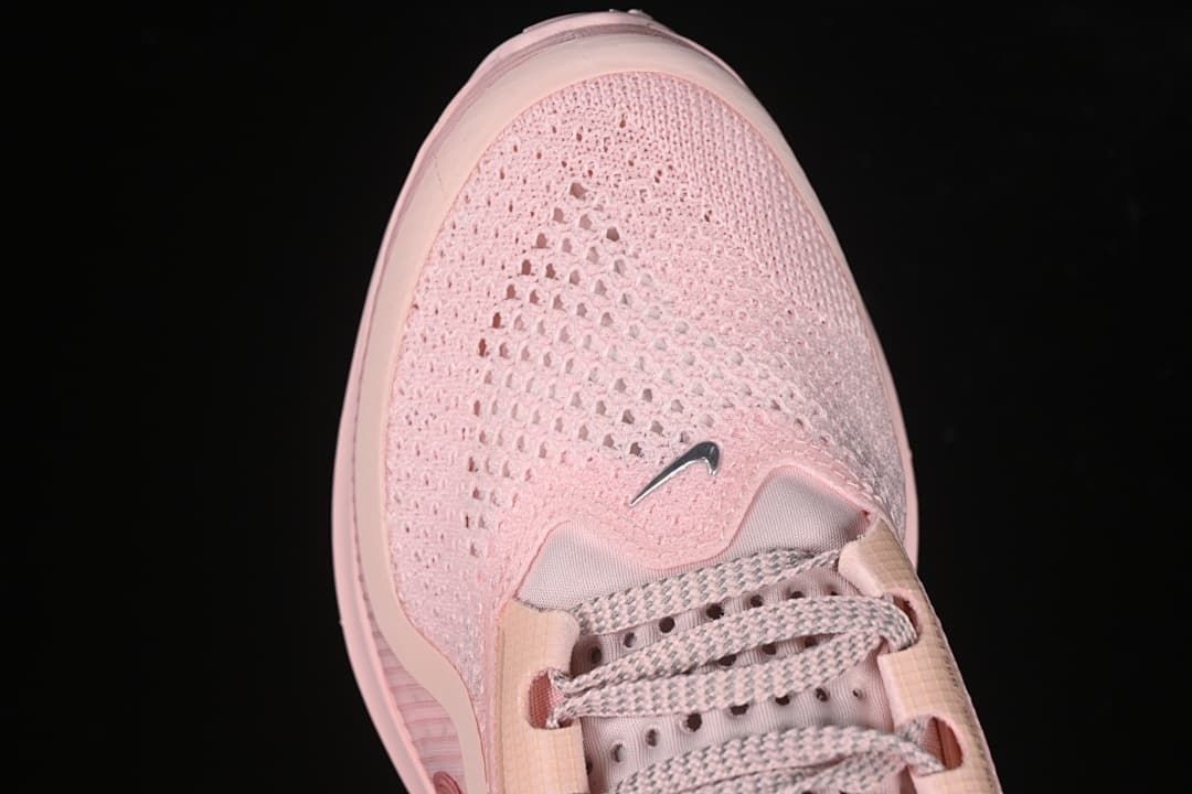 Top view of the perforated pink toe and patterned laces