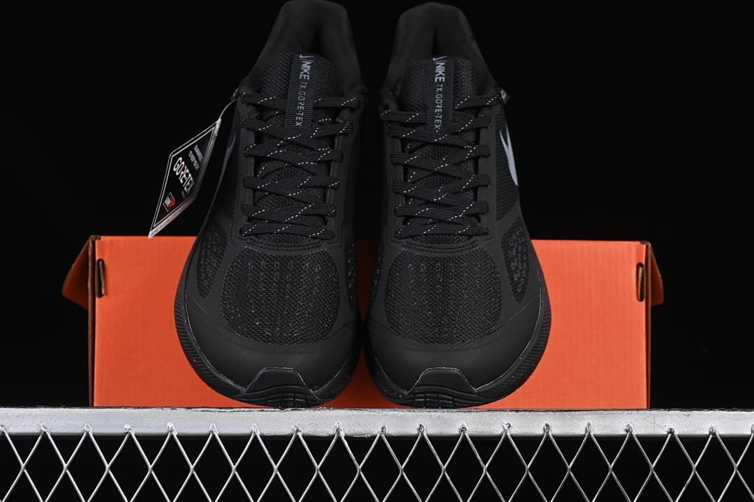 Front view of the pair standing on an orange shoe box.