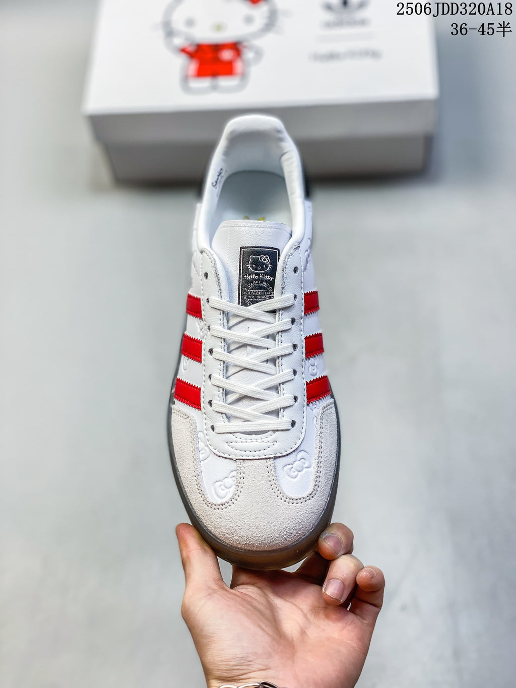 Front view showing the laces, red stripes, and character motifs