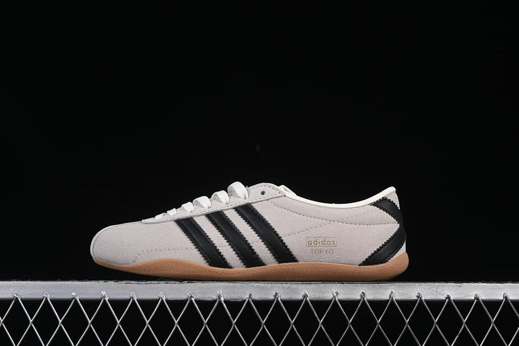 Side view of the adidas Tokyo sneaker in cream, black, and gum colors
