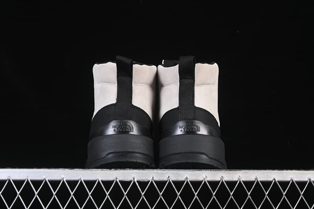 Rear view of both boots showing heel pull tabs