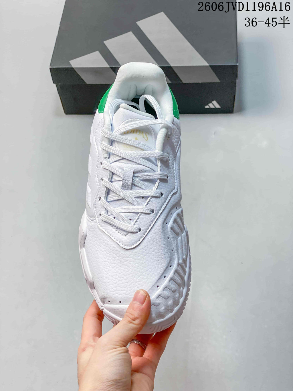 Top view of the white lace-up tennis shoe with perforated details.