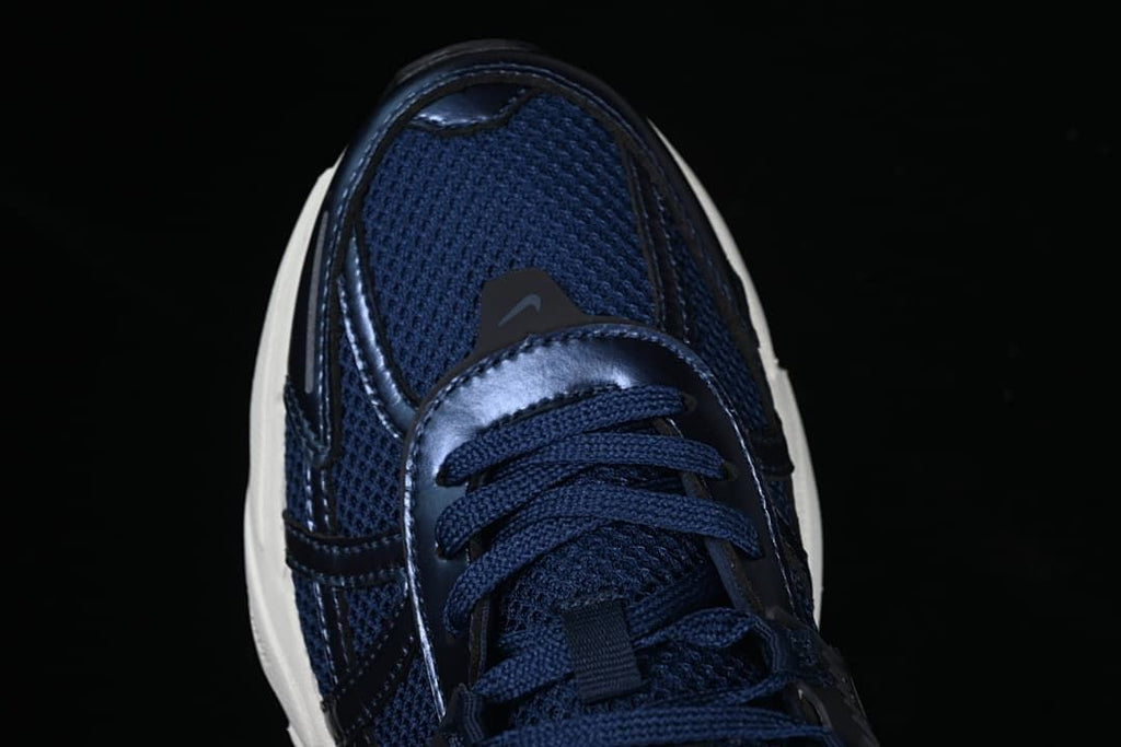 Top-down view of the navy mesh toe and laces