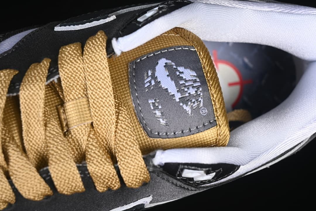 Close-up of the gold-tone laces and tongue label