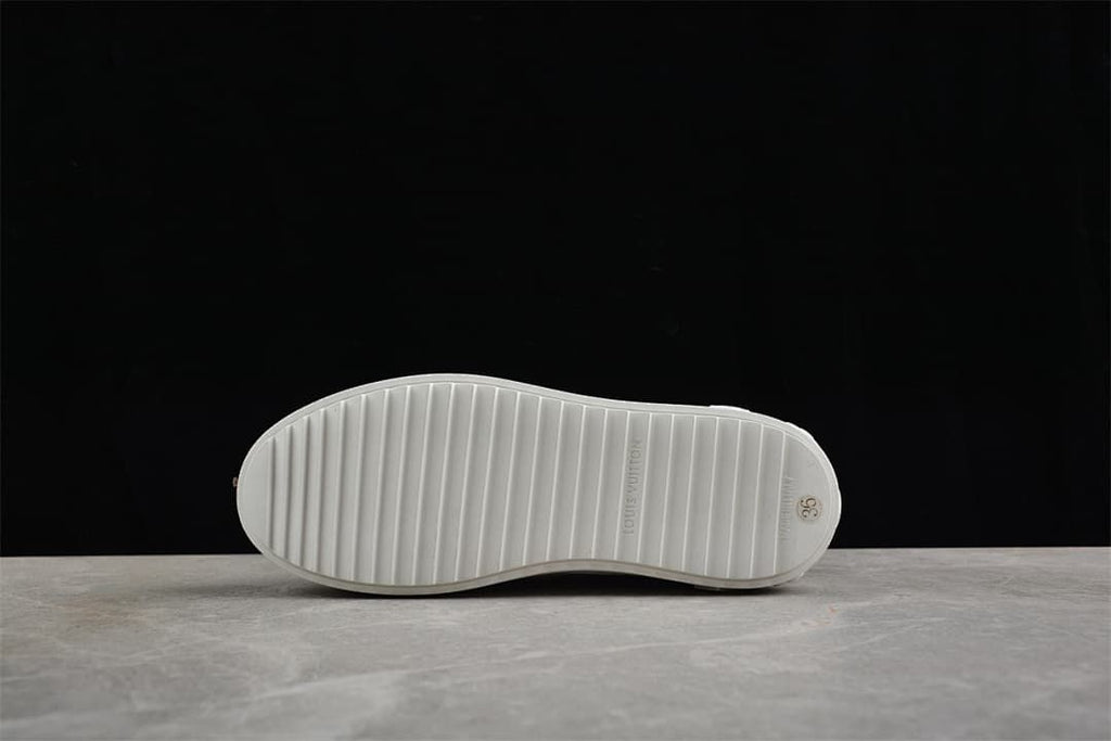 Underside of the sneaker showing the ridged outsole and size marking 36