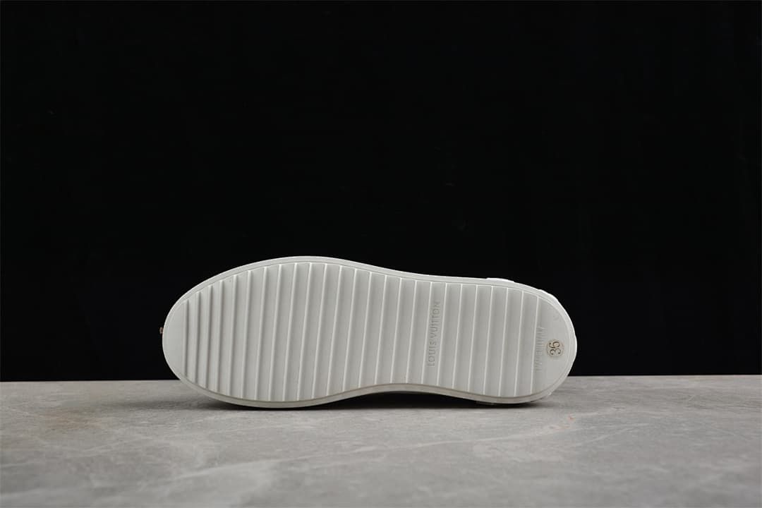Underside of the sneaker showing the ridged outsole and size marking 36
